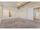 Large main bedroom with neutral carpet and archway to main bath at 6804 Tropicaire St, Las Vegas, NV 89149