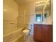 Bathroom with vanity, toilet, and shower-tub combo at 7469 Margollini St, Las Vegas, NV 89148
