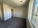 Bright bedroom featuring a neutral color palette and a large window with natural light at 7469 Margollini St, Las Vegas, NV 89148