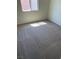 Cozy bedroom with neutral walls and carpeted floors, illuminated by sunlight at 7469 Margollini St, Las Vegas, NV 89148