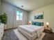 Bright bedroom featuring a large window and neutral decor at 7469 Margollini St, Las Vegas, NV 89148