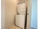 Stackable white washer and dryer in the laundry area at 7469 Margollini St, Las Vegas, NV 89148