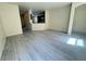 A bright, open-concept living area boasts new flooring and a kitchen view at 7469 Margollini St, Las Vegas, NV 89148