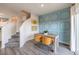 Modern dining area with stylish chairs, decorative wall, and adjacent staircase for easy access to upper floors at 7925 Pandora Sky St # 392, Las Vegas, NV 89084
