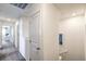 Clean, carpeted hallway with doors leading to various rooms, with ample lighting and neutral wall colors at 7935 Pandora Sky St # 393, North Las Vegas, NV 89084