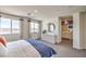View of a large, well-lit primary bedroom showcasing an ensuite bathroom and nice views at 7935 Pandora Sky St # 393, North Las Vegas, NV 89084