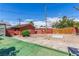 A view of the backyard featuring an outbuilding, landscaping, and fencing at 812 Pyramid Dr, Las Vegas, NV 89107