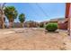A spacious backyard with landscaping, an outbuilding, and block wall at 812 Pyramid Dr, Las Vegas, NV 89107