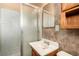 Bathroom showcasing a glass-enclosed shower and vanity with a basin sink at 812 Pyramid Dr, Las Vegas, NV 89107