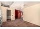 An open bedroom area leads to other rooms with a glimpse of tile flooring at 812 Pyramid Dr, Las Vegas, NV 89107