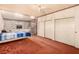 Spacious bedroom features built-in storage and sliding doors for ample natural light at 812 Pyramid Dr, Las Vegas, NV 89107