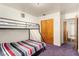 Shared bedroom features bunk beds, closet space, and bright lighting at 812 Pyramid Dr, Las Vegas, NV 89107
