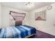 This cozy bedroom includes curtains, a bed, and bright natural lighting at 812 Pyramid Dr, Las Vegas, NV 89107