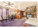 Open concept dining area, connected to the kitchen with purple carpeting at 812 Pyramid Dr, Las Vegas, NV 89107
