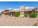 Charming single-story home with stone chimney, stone facade and brick paver driveway at 812 Pyramid Dr, Las Vegas, NV 89107