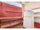 An older kitchen space with shelves, a refrigerator, and countertop work area at 812 Pyramid Dr, Las Vegas, NV 89107