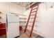 An older kitchen space with shelves, refrigerator, and paint in need of some TLC at 812 Pyramid Dr, Las Vegas, NV 89107