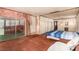 Comfortable main bedroom with a sunroom, built-in closets, and a private bathroom at 812 Pyramid Dr, Las Vegas, NV 89107