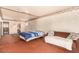 Bright main bedroom with neutral walls, ample space, and a cozy seating area at 812 Pyramid Dr, Las Vegas, NV 89107