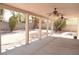 Covered backyard patio featuring ceiling fans and a spacious concrete floor at 825 Cornerstone Pl, North Las Vegas, NV 89031