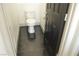 Modern bathroom features a toilet and sleek black door at 825 Cornerstone Pl, North Las Vegas, NV 89031