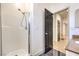 Bright bathroom featuring a tiled shower with a glass door and chrome hardware at 825 Cornerstone Pl, North Las Vegas, NV 89031