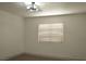 Bright bedroom with neutral carpet, a modern ceiling fan, and a window with blinds at 825 Cornerstone Pl, North Las Vegas, NV 89031