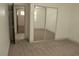 Bedroom featuring a closet with sliding mirrored doors and entry way to another room at 825 Cornerstone Pl, North Las Vegas, NV 89031