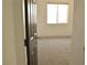 Bright bedroom featuring neutral carpet and a bright window at 825 Cornerstone Pl, North Las Vegas, NV 89031