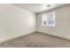Neutral bedroom with carpeted floors and large window for natural light and an open feel at 825 Cornerstone Pl, North Las Vegas, NV 89031