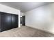Neutral bedroom with carpeted floors, a large closet, and an ensuite bathroom for privacy at 825 Cornerstone Pl, North Las Vegas, NV 89031