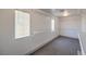 Walk-in closet featuring carpet flooring, metal shelves, and a window at 825 Cornerstone Pl, North Las Vegas, NV 89031