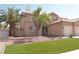 A delightful two-story residence featuring a tile roof, a three-car garage, and desert landscaping at 825 Cornerstone Pl, North Las Vegas, NV 89031