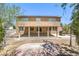 Two-story home with a covered patio, built-in grill, and a spacious yard at 825 Cornerstone Pl, North Las Vegas, NV 89031