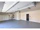 Spacious garage with ample storage cabinets and modern lighting fixtures at 825 Cornerstone Pl, North Las Vegas, NV 89031