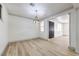 Spacious living room featuring hardwood floors, modern light fixture, and neutral paint at 825 Cornerstone Pl, North Las Vegas, NV 89031