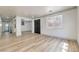 Bright living room features wood-look floors and an open floor plan perfect for entertaining at 825 Cornerstone Pl, North Las Vegas, NV 89031