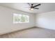 Large main bedroom featuring ceiling fan and window at 825 Cornerstone Pl, North Las Vegas, NV 89031
