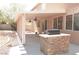 Covered patio with an outdoor kitchen and built-in grill at 825 Cornerstone Pl, North Las Vegas, NV 89031
