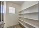 Well-organized pantry featuring white shelving, providing ample storage space at 825 Cornerstone Pl, North Las Vegas, NV 89031