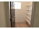 Well-organized pantry with multiple shelves for storage and easy access, enhancing the functionality of the kitchen area at 825 Cornerstone Pl, North Las Vegas, NV 89031