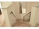 Modern stairwell with wooden stairs and metal railings at 825 Cornerstone Pl, North Las Vegas, NV 89031