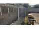 Backyard with block and chainlink fence and a grill at 845 Bladensburg St, Las Vegas, NV 89110