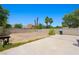 A large, empty backyard area with cinderblock fence and clear blue skies at 845 Bladensburg St, Las Vegas, NV 89110