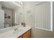 Clean bathroom with a single sink vanity and a window for natural light at 845 Bladensburg St, Las Vegas, NV 89110