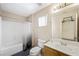 Bathroom features a tub/shower combo, toilet, and vanity sink with a framed mirror at 845 Bladensburg St, Las Vegas, NV 89110