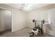 Carpeted room has a weight bench, dumbbells, and a single window for natural lighting at 845 Bladensburg St, Las Vegas, NV 89110