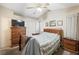 Bedroom with dresser, nightstands and ceiling fan at 845 Bladensburg St, Las Vegas, NV 89110