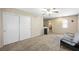 Large bonus room featuring neutral walls, plush carpeting, ceiling fan and large closet at 845 Bladensburg St, Las Vegas, NV 89110
