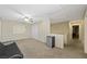 Bright bonus room boasts neutral walls, plush carpeting and a ceiling fan at 845 Bladensburg St, Las Vegas, NV 89110